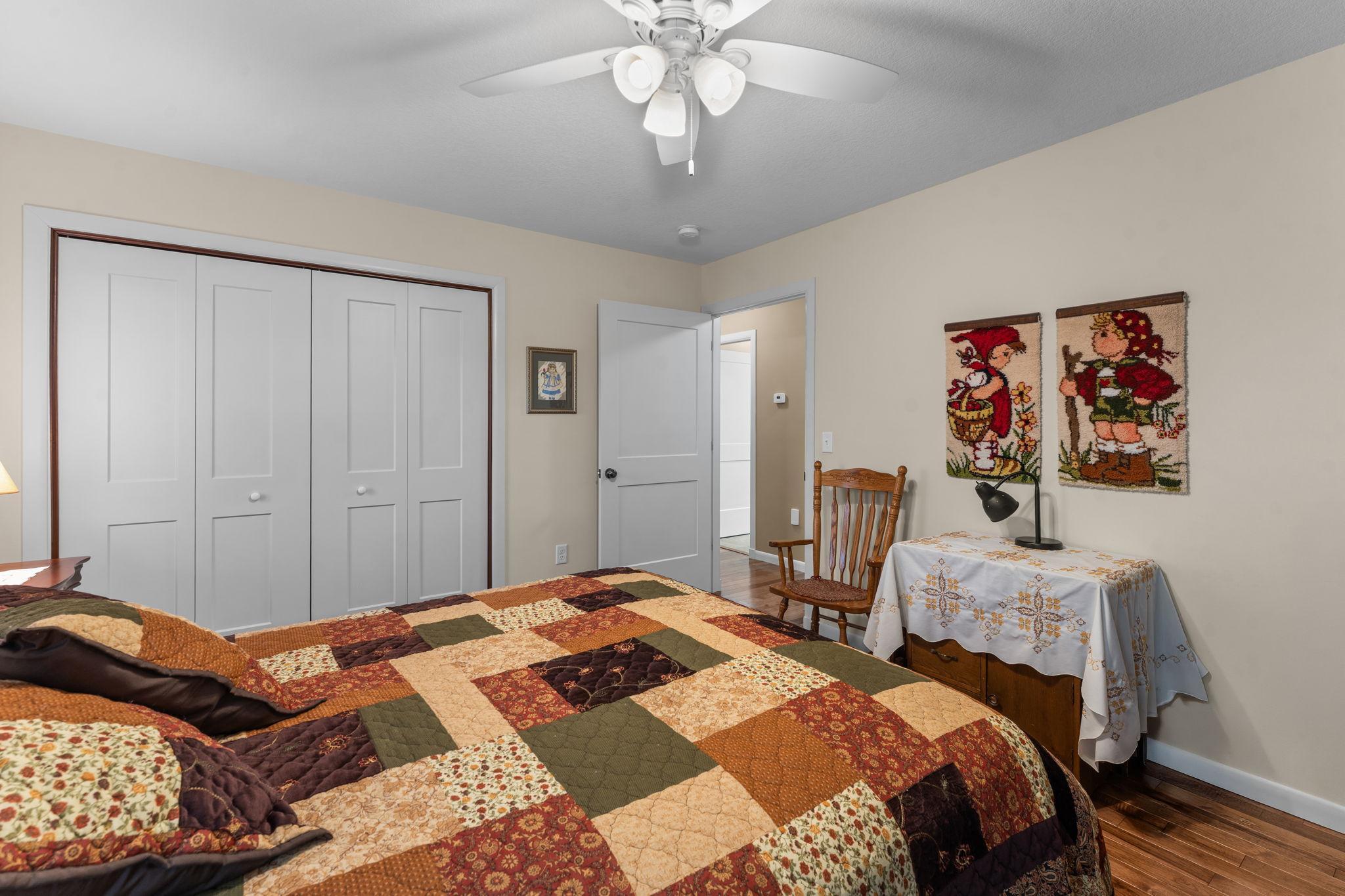 The hardwood floors extend into this bedroom.