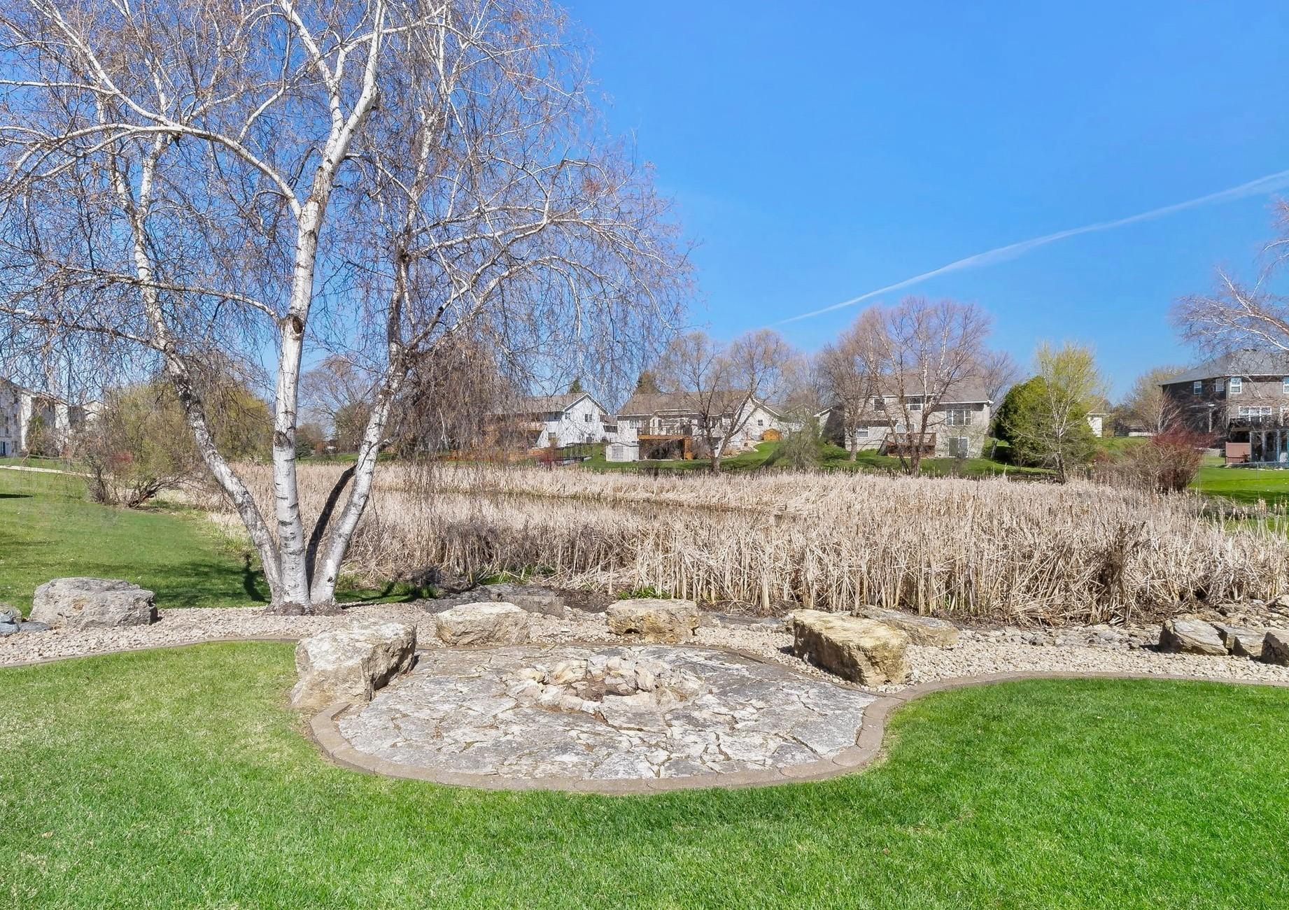 Note the expansive fire pit; with limestone boulders to sit on. The underground pit has a water drainage line which runs to the pond