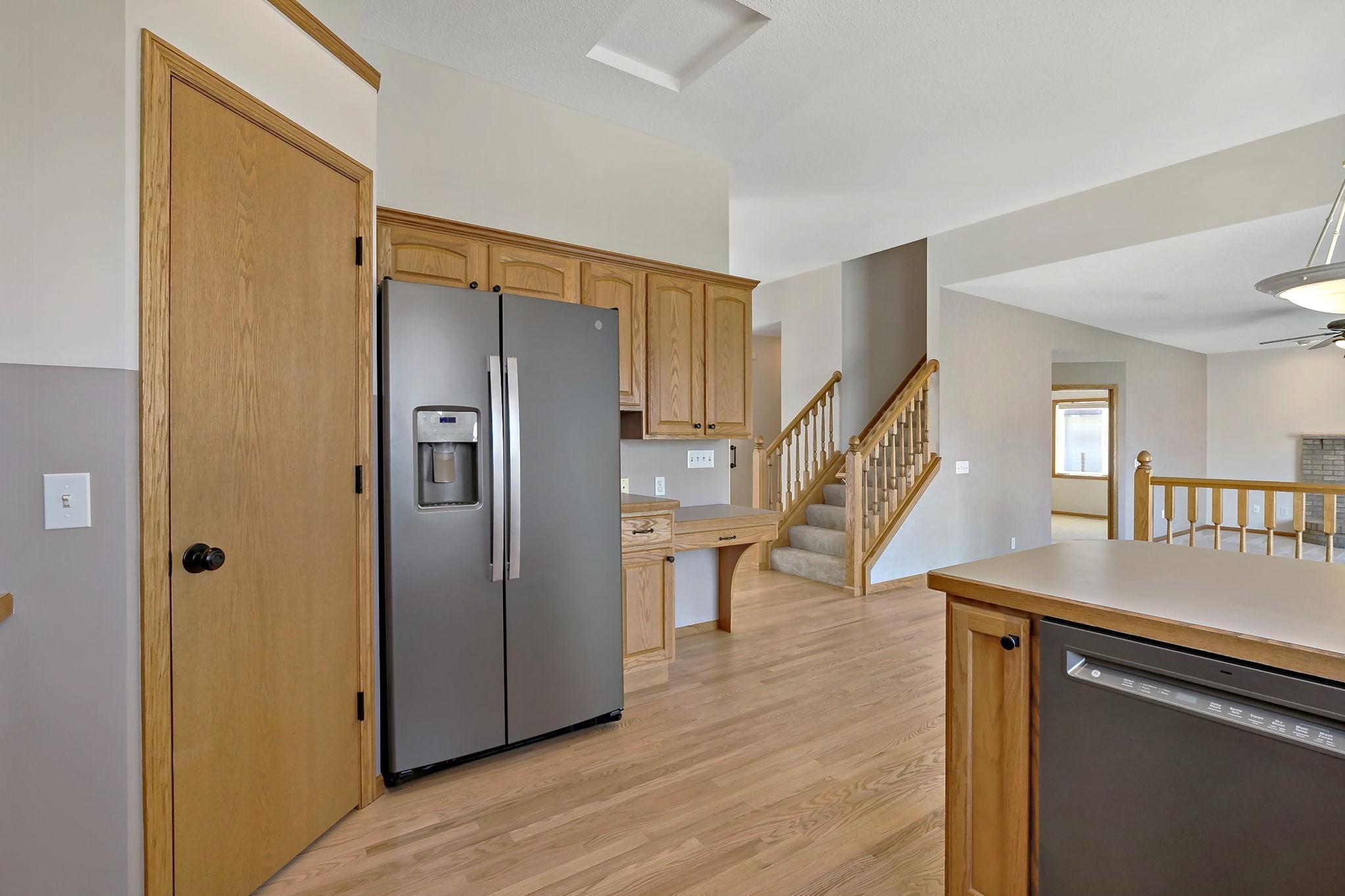 Kitchen with a nice walk-in pantry, a breakfast bar and extra recessed lighting