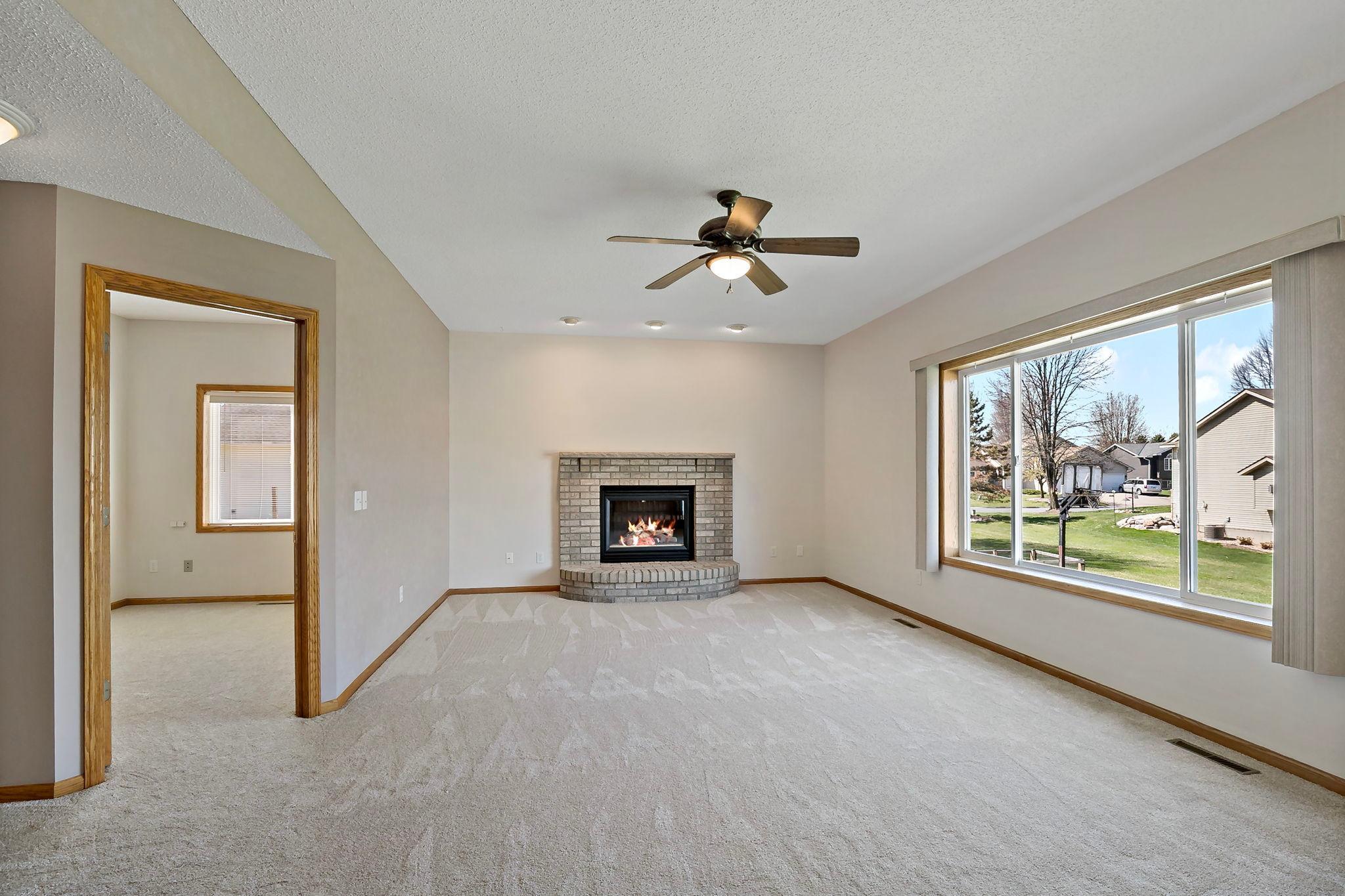 Larger 23' x 13' sunken main floor Family Room. Note the extra recessed lighting above the Fireplace