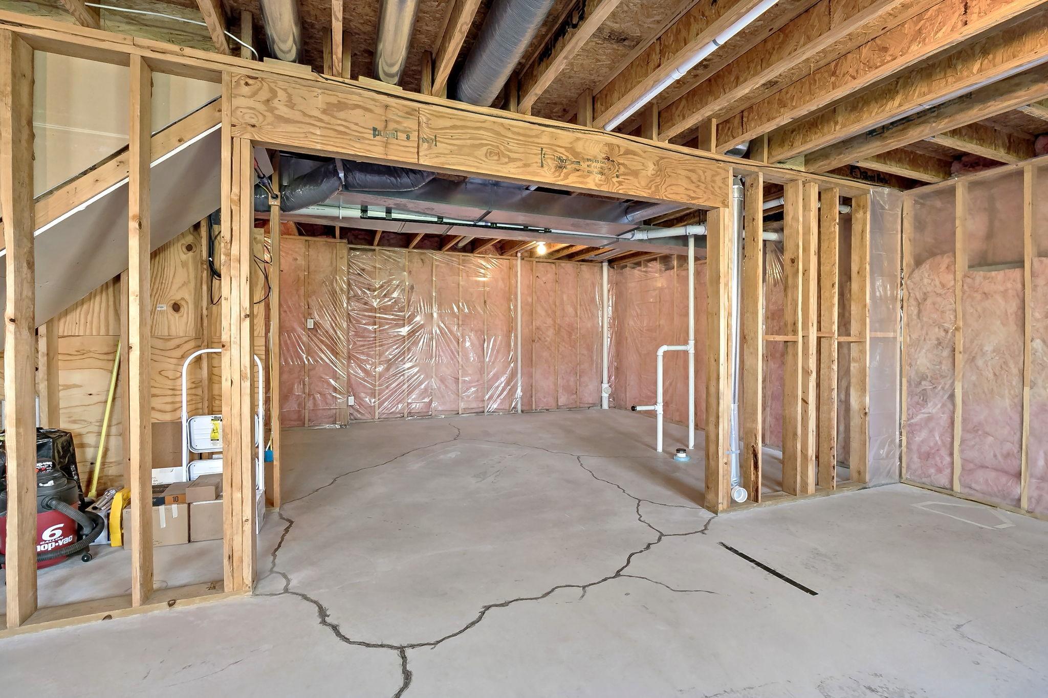 Note the rough-in plumbing for a basement bathroom