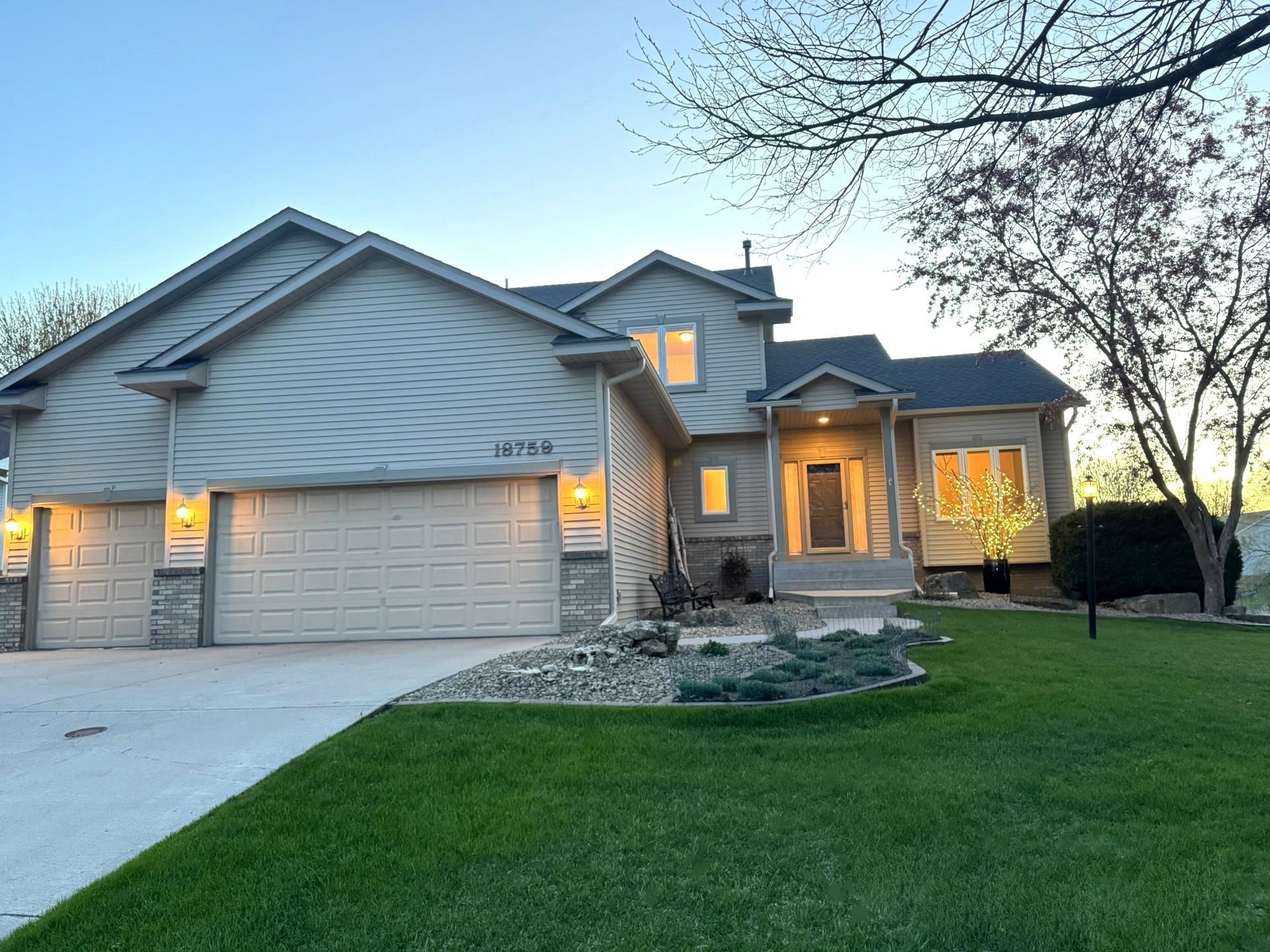 Note the cement driveway and the extensive storage shelving available in the garage