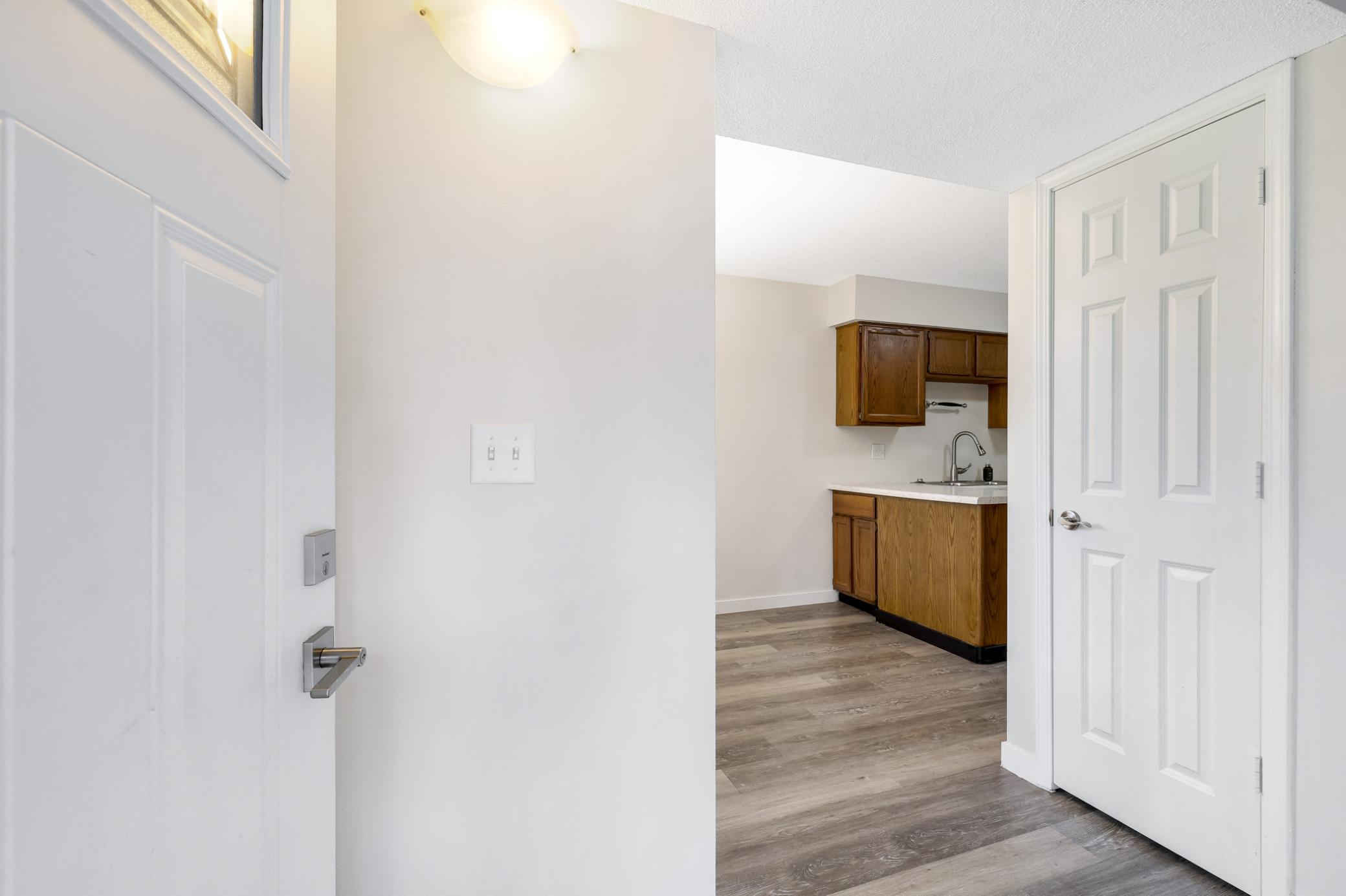 Charming end-unit townhome with mature trees, welcoming curb appeal, and a private setting. Includes a detached 2-car garage and association-maintained exterior for easy living.