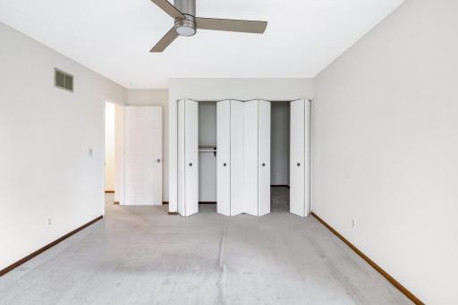 Generous upper-level bedroom with large closet and soft natural lightâcomfortable and versatile.