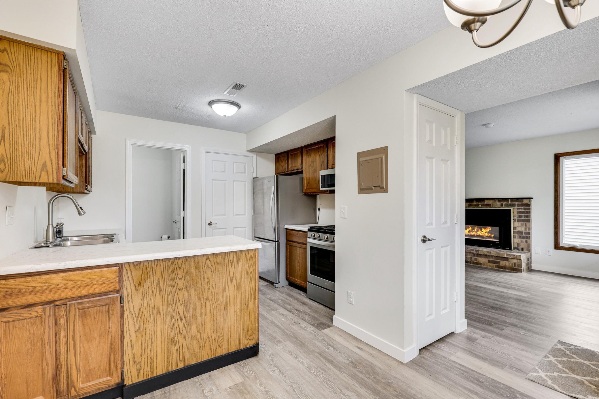 Open sightlines from kitchen to dining area, creating a connected and inviting main-level layout.