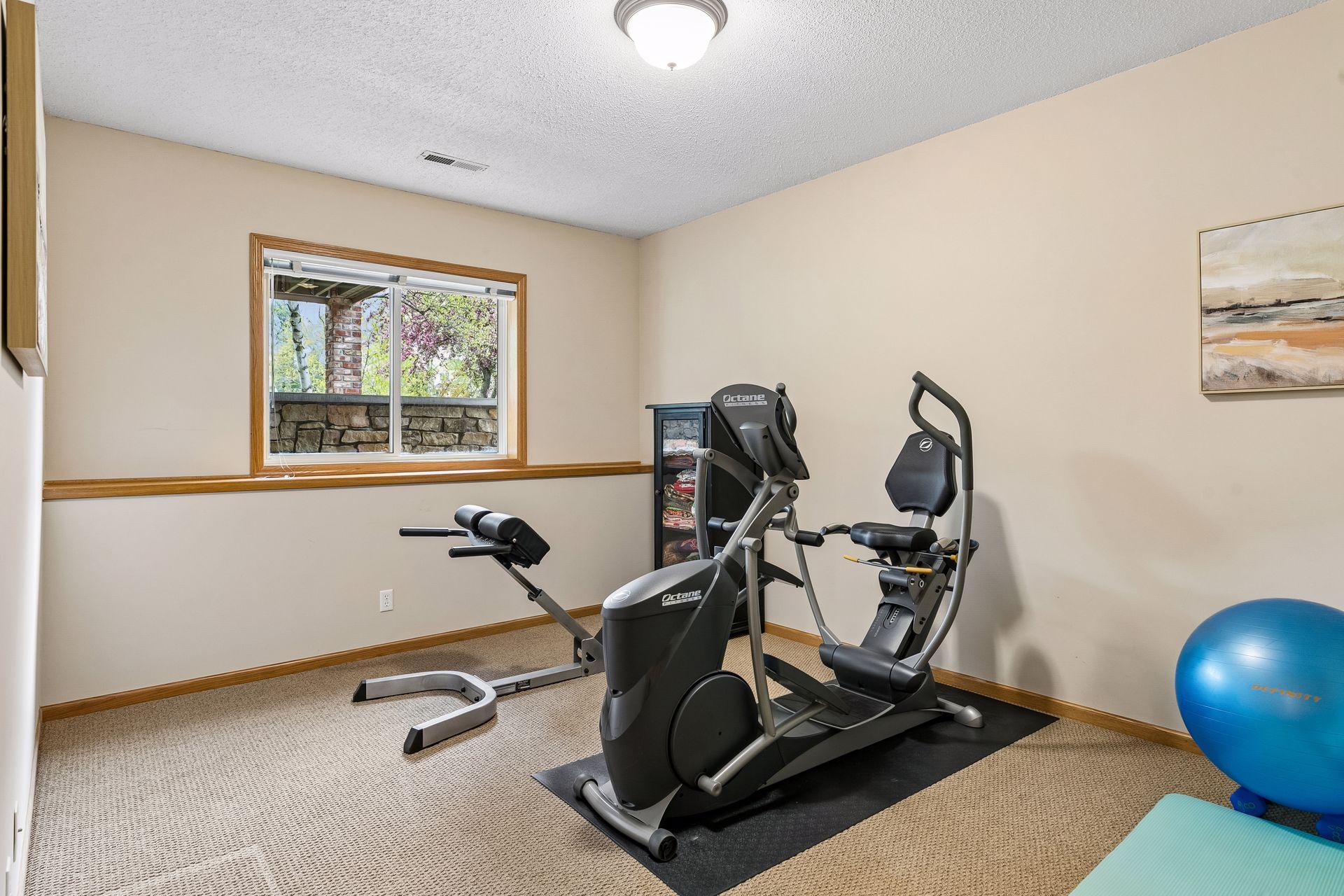 Bedroom 4, currently used as exercise room, has large walk in closet