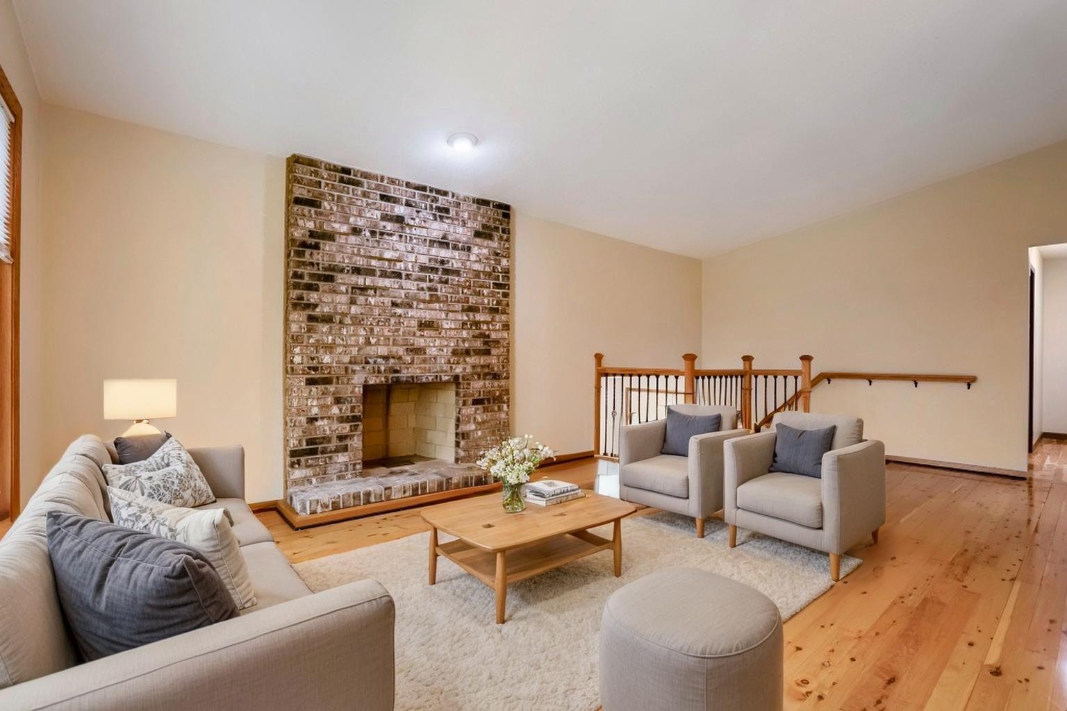 Bright and inviting main living room with decorative fireplace