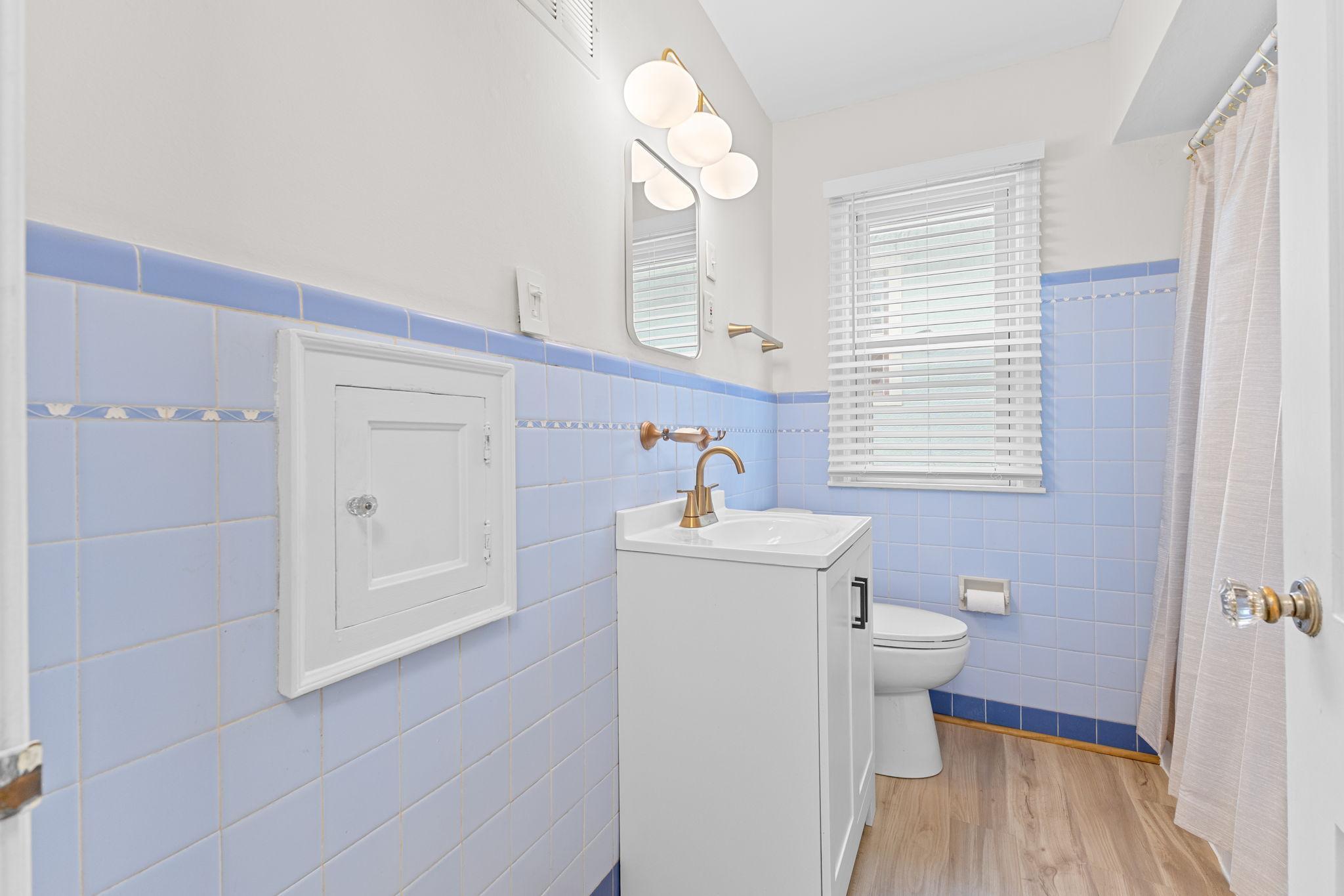 The renovated bathroom is clean and current while still maintaining its original charm!
