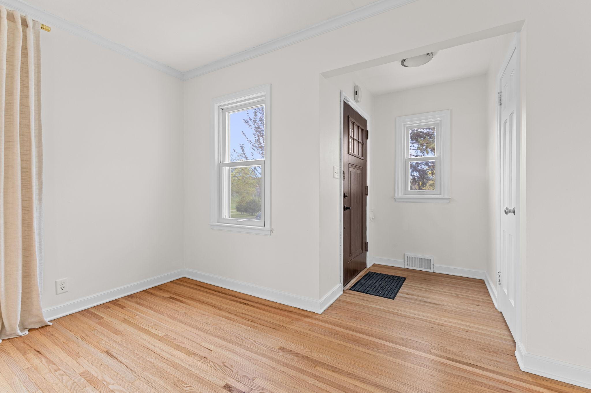 Neatly tuck coats and shoes out of sight with a convenient entryway closet.