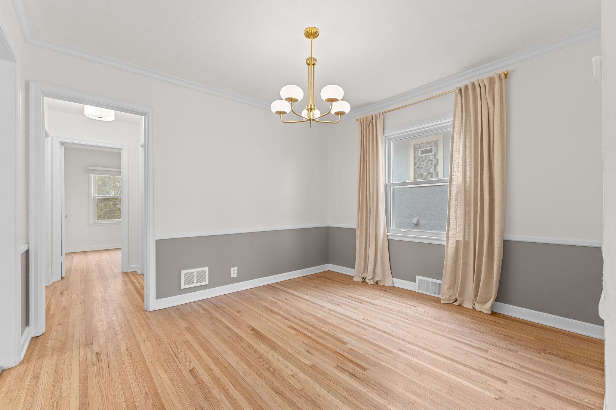 Transition into the formal dining area, open to the kitchen, perfect for easy meals and effortless entertaining!