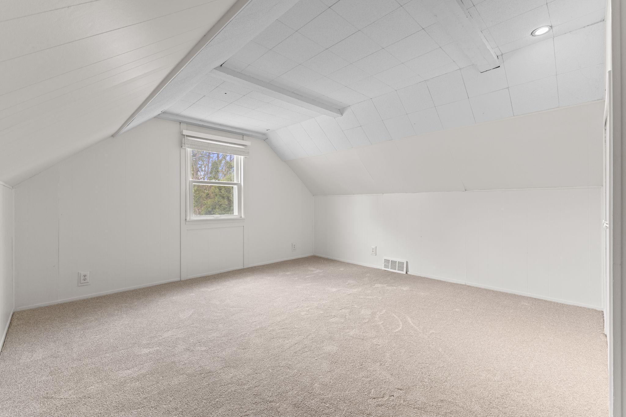 Second upper level bedroom with plenty of space for your preferred bed size and any additional large furniture.