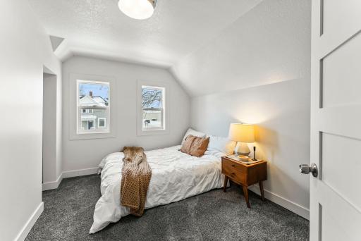 The primary bedroom is warm and welcoming.
