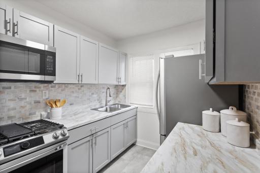New cabinets, LVT flooring and stainless steel appliances.