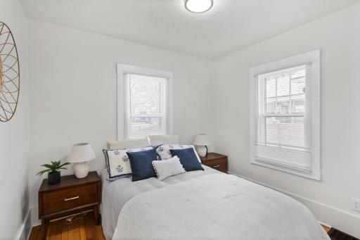Main level bedroom with refinished hardwood floors and fresh paint.