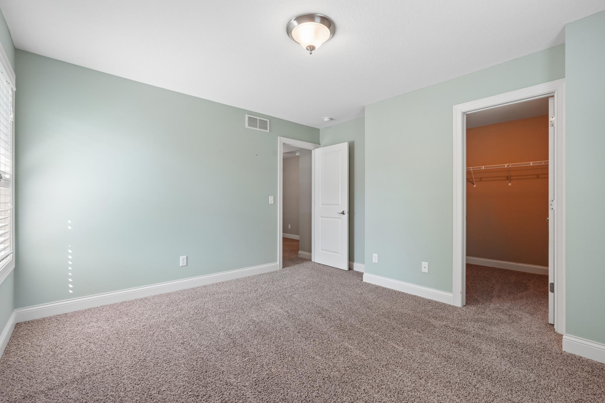 Bedroom 1 with walk-in closet.