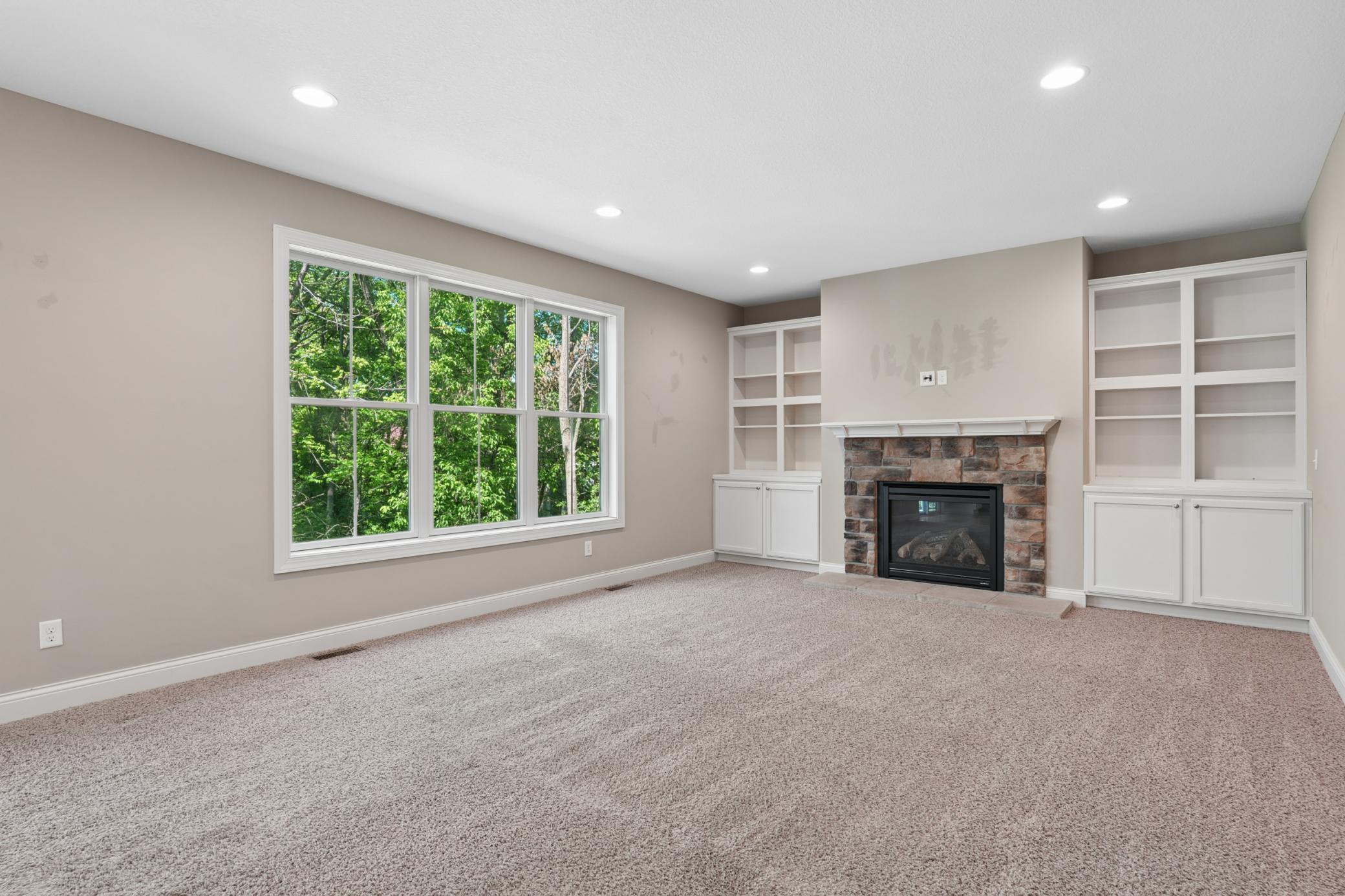 Family room with gas fireplace and built-ins.