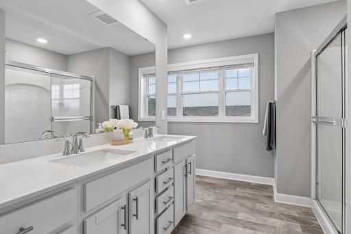 Gorgeous ensuite 3/4 bathroom with solid surface raised height vanity.