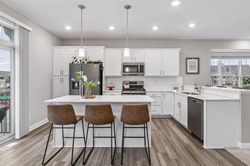 Easy to cook and entertain, and a beautiful sight for guests and owners alike with this crisp, white kitchen.