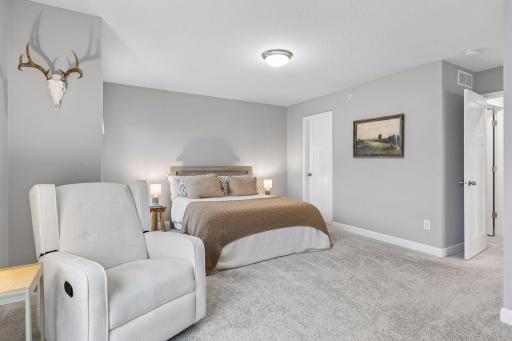 Large primary suite features two closets and a gorgeous en suite bathroom.