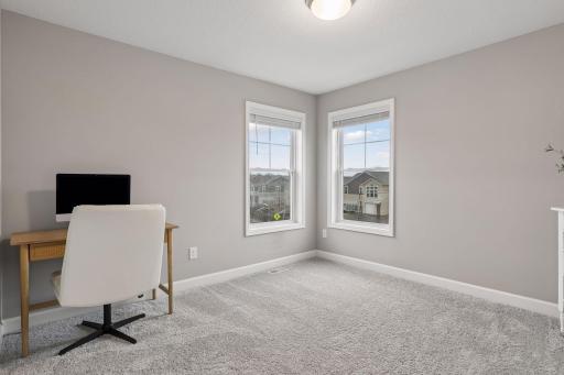 Two additional bedrooms are nice sized and have lovely windows.