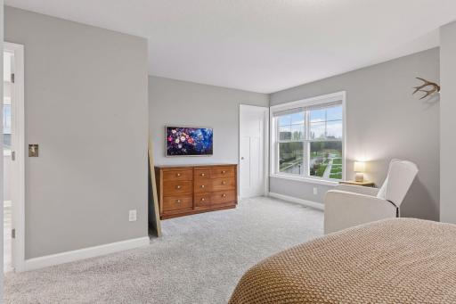 Large primary suite features two closets and a gorgeous en suite bathroom.