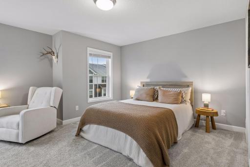 Large primary suite features two closets and a gorgeous en suite bathroom.