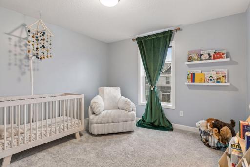 Two additional bedrooms are nice sized and have lovely windows.