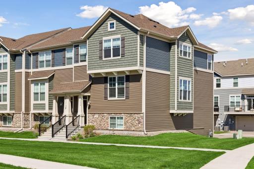 Stunning End Unit Townhome with terrific SW exposure, large lawn, and tons of features!