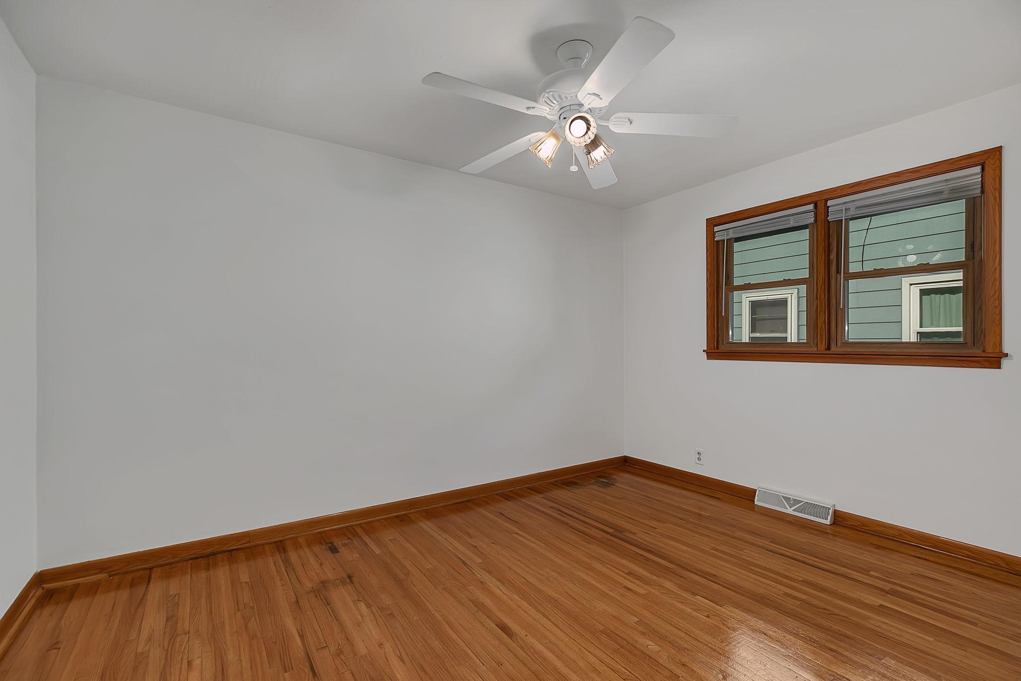 Bedroom 2 with hardwood floors