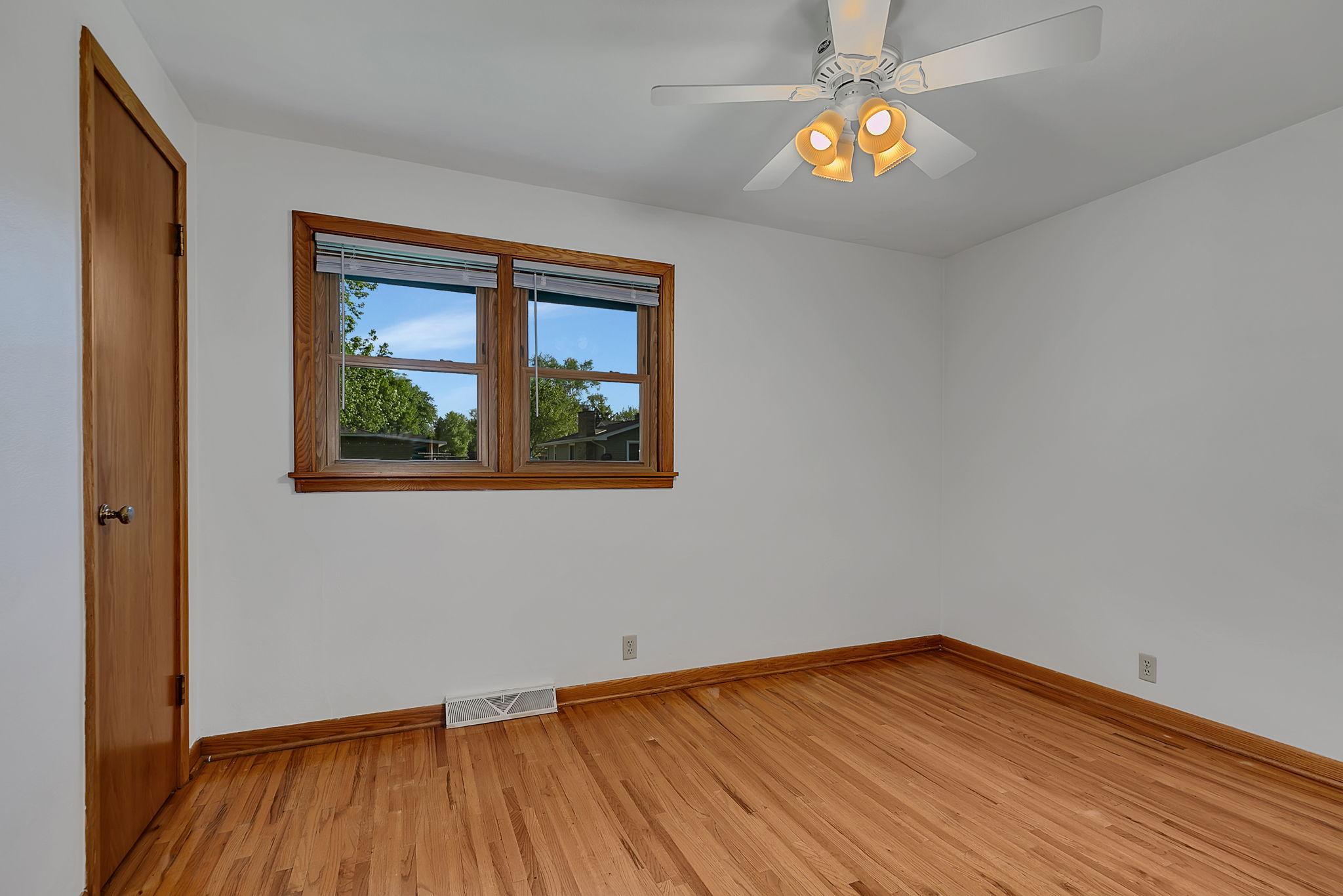 bedroom 3 with hardwood floors