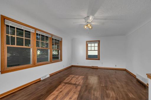 Bright Living Room with beautiful natural light, large windows and rich woodwork
