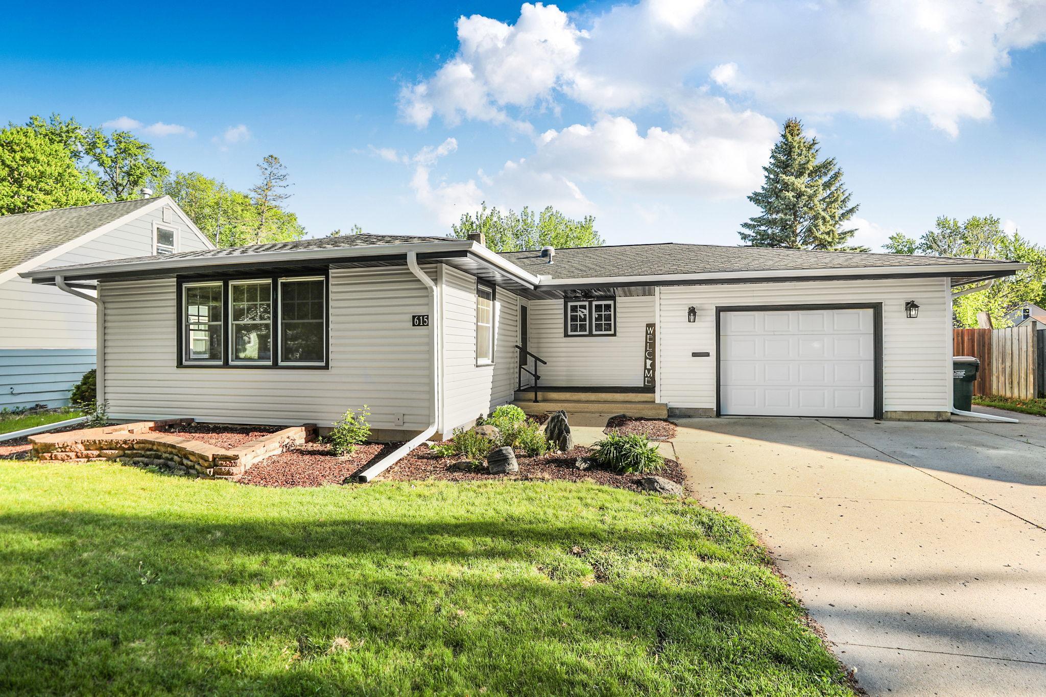 Beautiful updated exterior finishes, a welcoming front entry, attached garage, with fenced in back yard