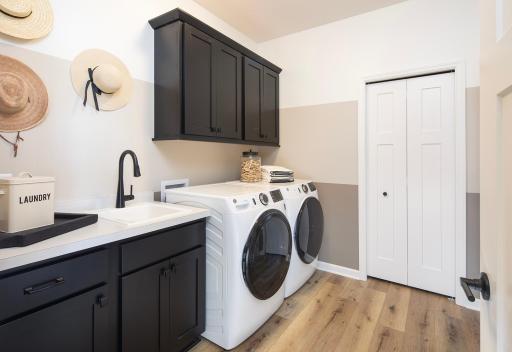 Laundry right where you need it - main level access with room to handle loads without the extra steps - *Photo of model home, design selections may vary