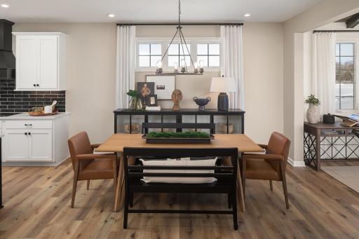 Easy going dining space with great natural lights and a layout that's perfect for everyday meals or hosting friends - *Photo of model home, design selections may vary