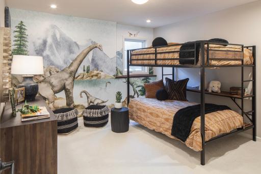 Lower level bedroom with a comfortable setup and extra space, perfect for guests, kids, or creating a room that fits your needs - *Photo of model home, design selections may vary