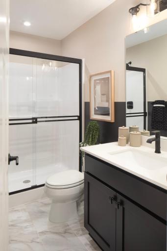 Lower level bedroom adds and extra layer of convenience, so everything you need is tight there when you're spending time downstairs - *Photo of model home, design selections may vary