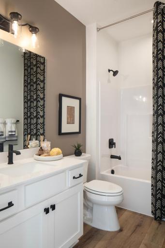 Main level bathroom right where you need it, offering a clean, practical space for guests and everyday use
- *Photo of model home, design selections may vary