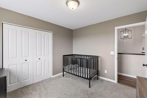 First of 2 similar sized bedrooms down the hallway.
