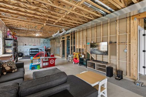 The lower level provides the opportunity for an additional bedroom and roughed bathroom .