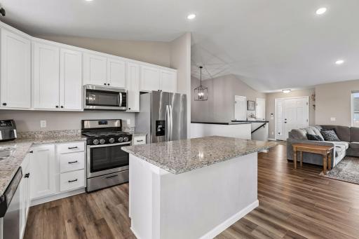 Kitchen cabinets are taller than standard giving additional space .