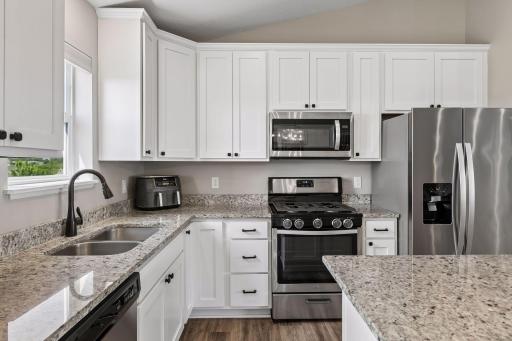 Granite countertops give plenty of working surface for baking & cooking,