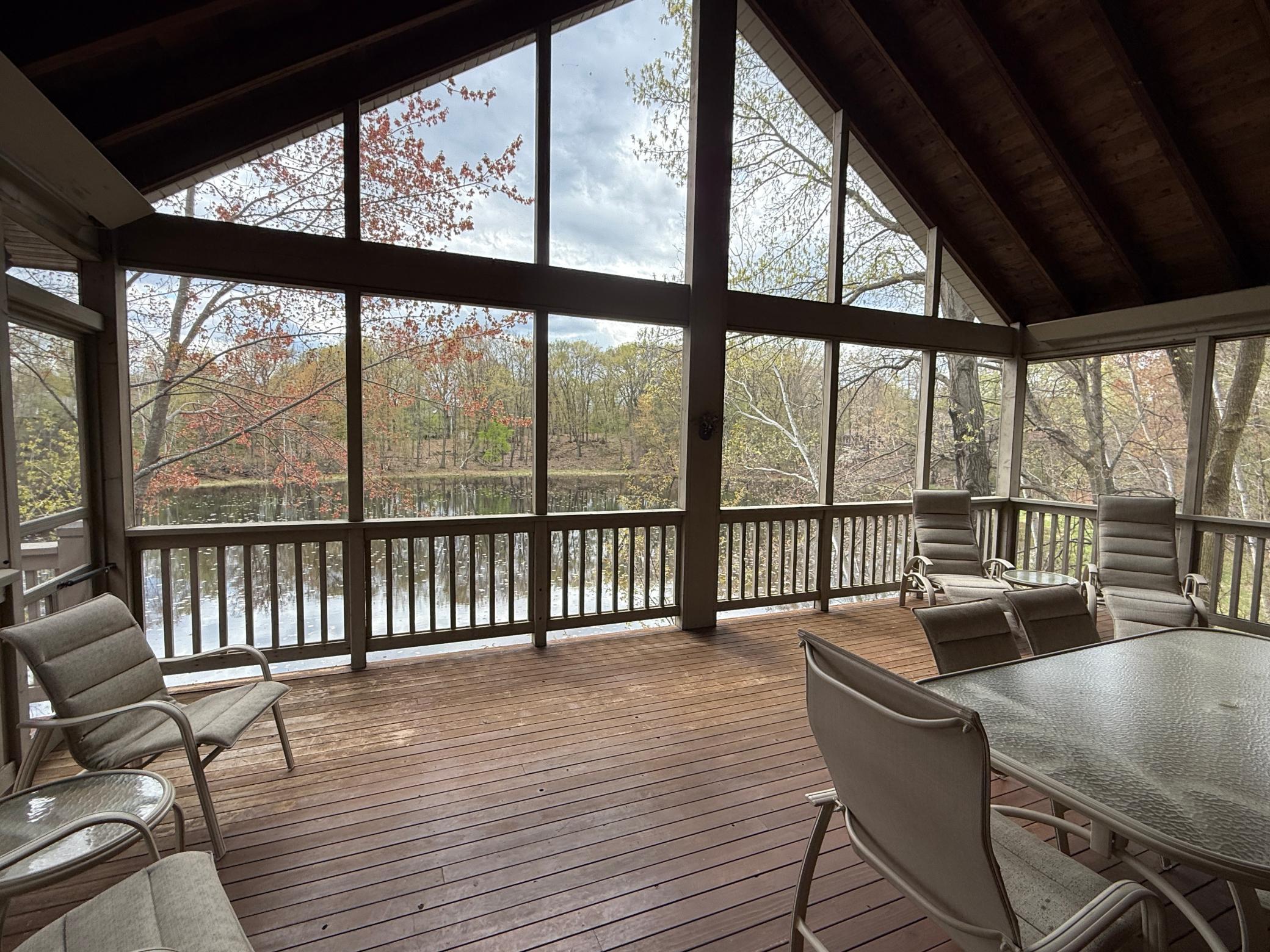The massive screened porch is a true retreat, perfect for relaxing or entertaining while taking in beautiful views