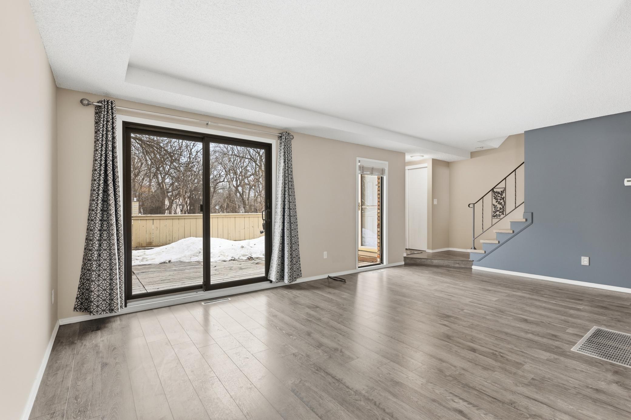 Main level living room with access to large front deck