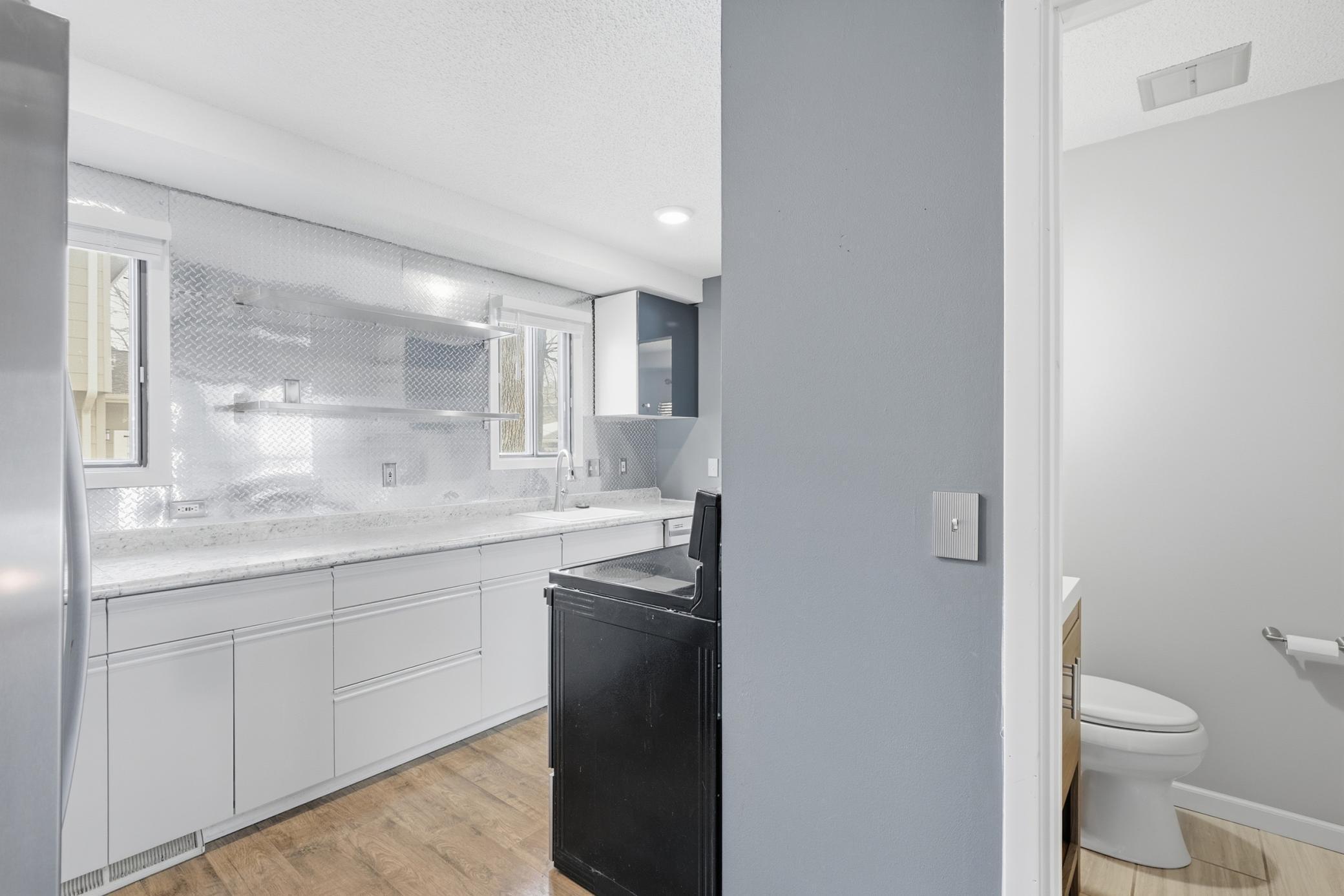 Kitchen with powder room around the corner