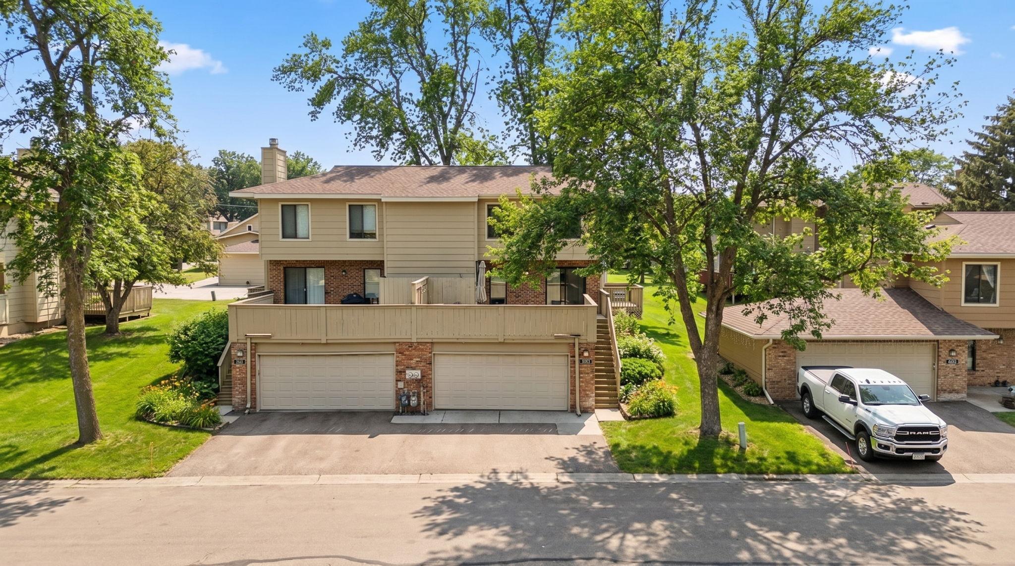 Situated at the back of the neighborhood this unit offers privacy and lush green space.