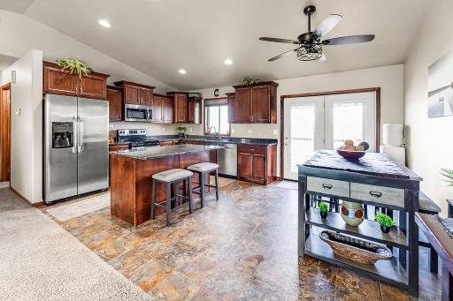 Breakfast bar island, Stainless appliances, Recessed lighting