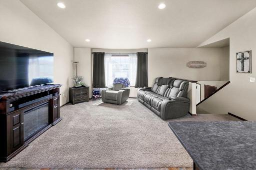 Living Room with vaulted ceilings, recessed lighting, open-concept living