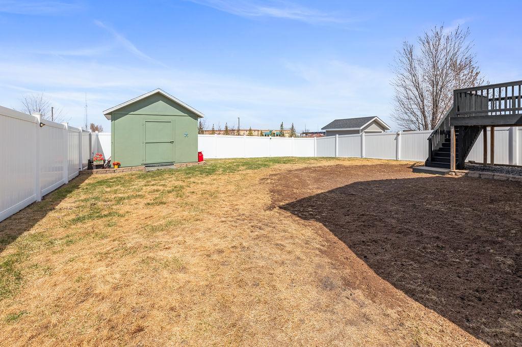 HUGE shed, privacy maintenance-free fencing, no backyard neighbors. Fresh dirt & seeding for grass