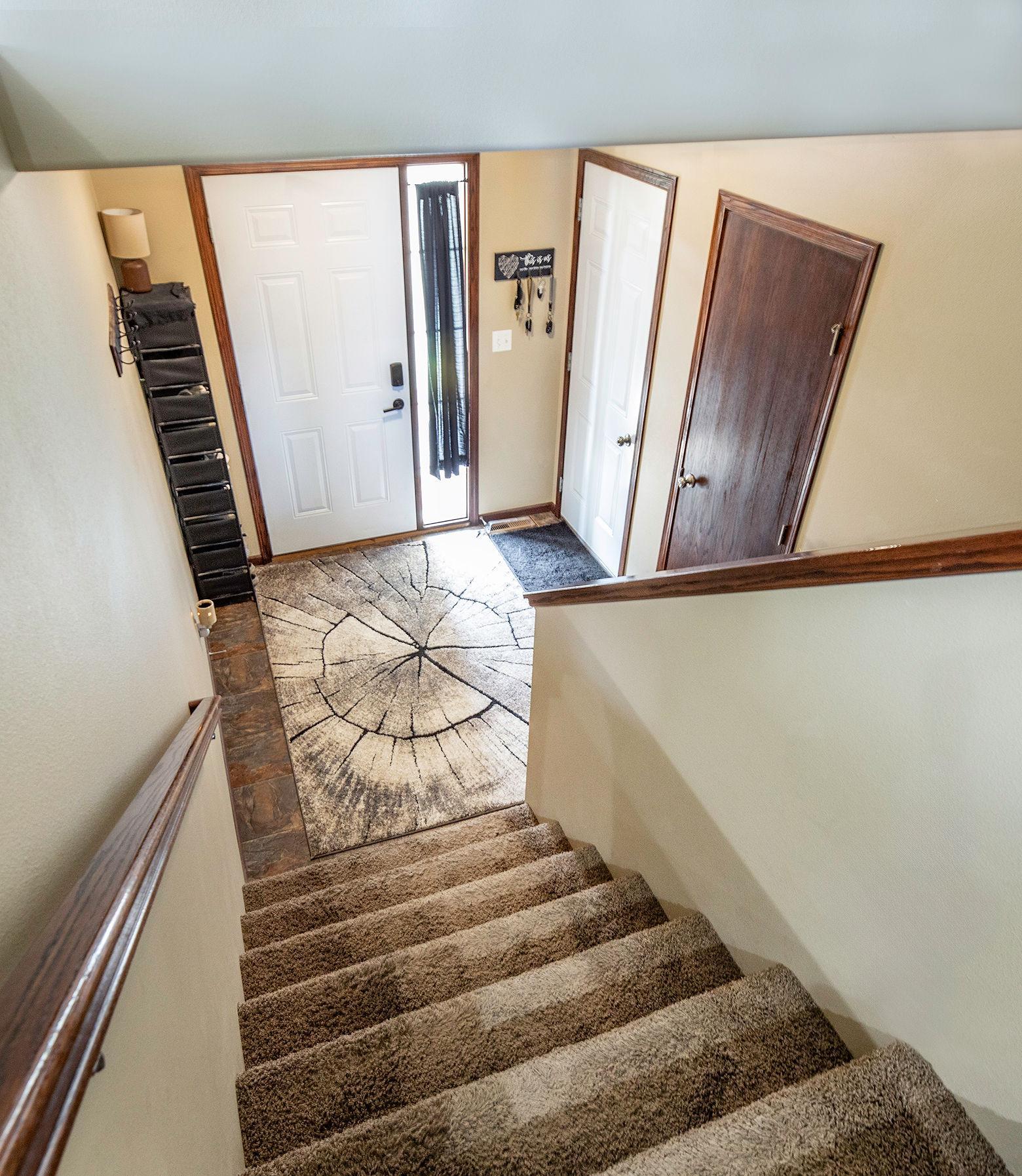 Spacious & bright foyer with garage entry & storage/coat closet