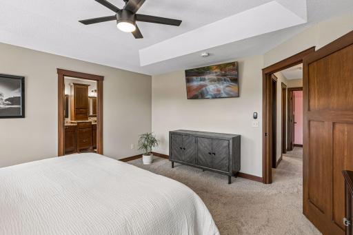 The primary suite includes direct access to the private en suite bath and walk-in closet, creating a comfortable owner's retreat with both convenience and privacy.